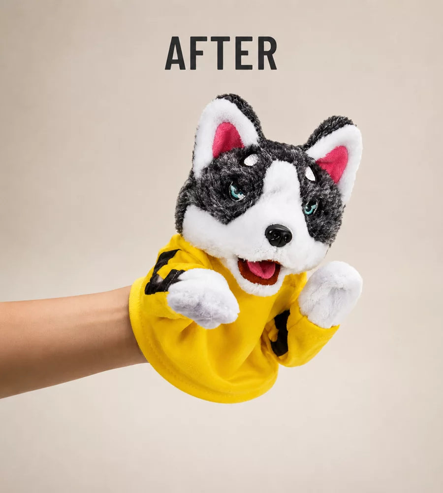 Hand slipping into the boxing husky puppet glove